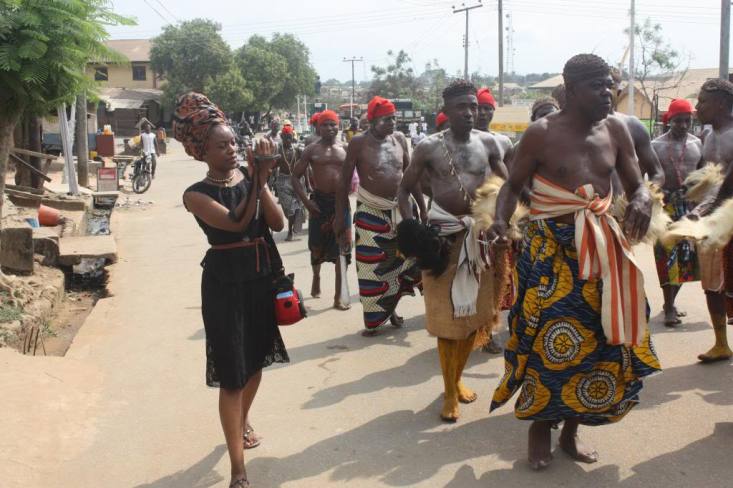 Filming warriors and elders in a ceremonial procession in Ugep, Cross River Nigeria