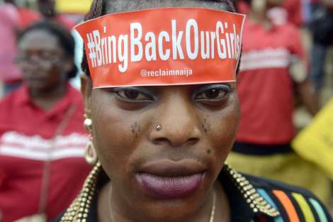 A woman with a sticker on her head bearing the slogan "Bring back our girls" marches for the release of the more than 200 abducted Chibok school girls in Lagos on May 29, 2014, during a demonstration by civil society groups and celebrities of the film and entertainment industries to press for the girls' release, seven weeks after their abduction by Islamist militant group Boko Haram, and on the occasion of Nigeria's Democracy Day.  Nigerian President Goodluck Jonathan vowed on May 29 total war against terrorism as the country's security forces stepped up efforts to rescue more than 200 schoolgirls kidnapped by Boko Haram Islamists 45 days ago. AFP PHOTO/PIUS UTOMI EKPEIPIUS UTOMI EKPEI/AFP/Getty Images 